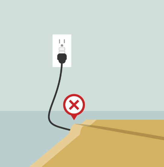 don't put electrical cords under rugs to prevent home fires for CK electric Blog on preventing electrical fires in Sykesville